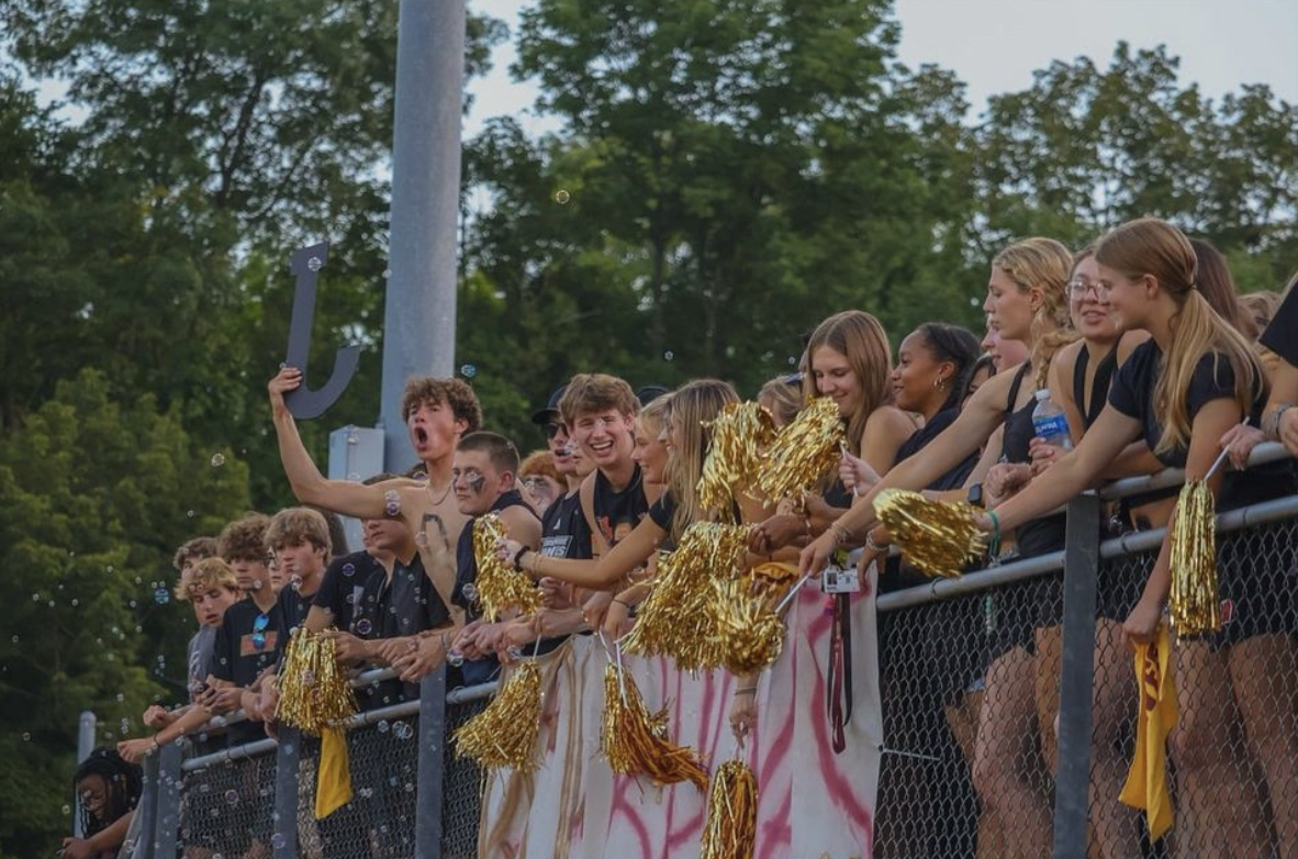 Students cheer on the Brebeuf football team against Chatard in preparation for the upcoming homecoming game! 